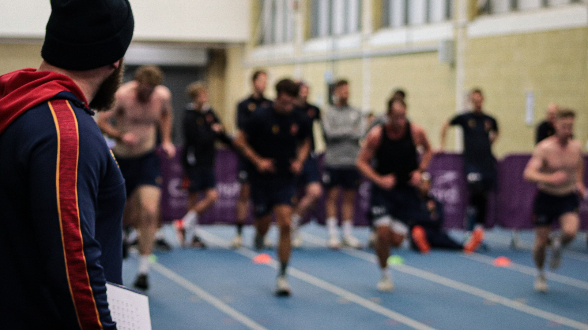 Essex Cricket Strength and Conditioning Coach, Harry McQueen watches on as the players take a fitness test.